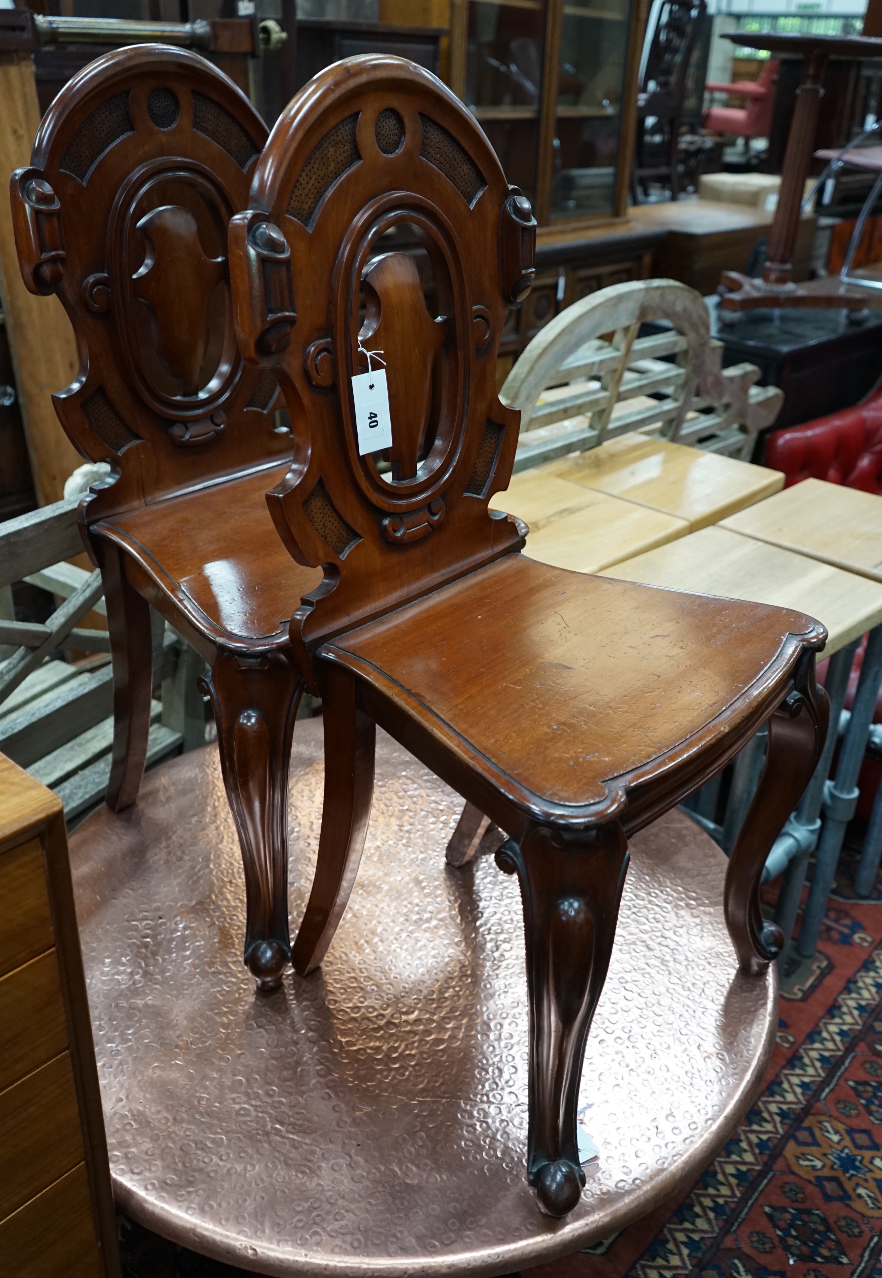 A pair of Victorian mahogay hall chairs